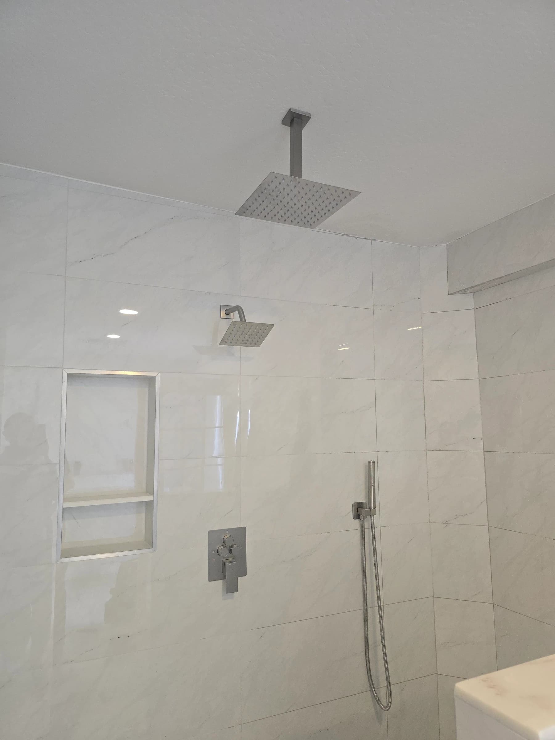 Rain shower head on a new chrome valve.