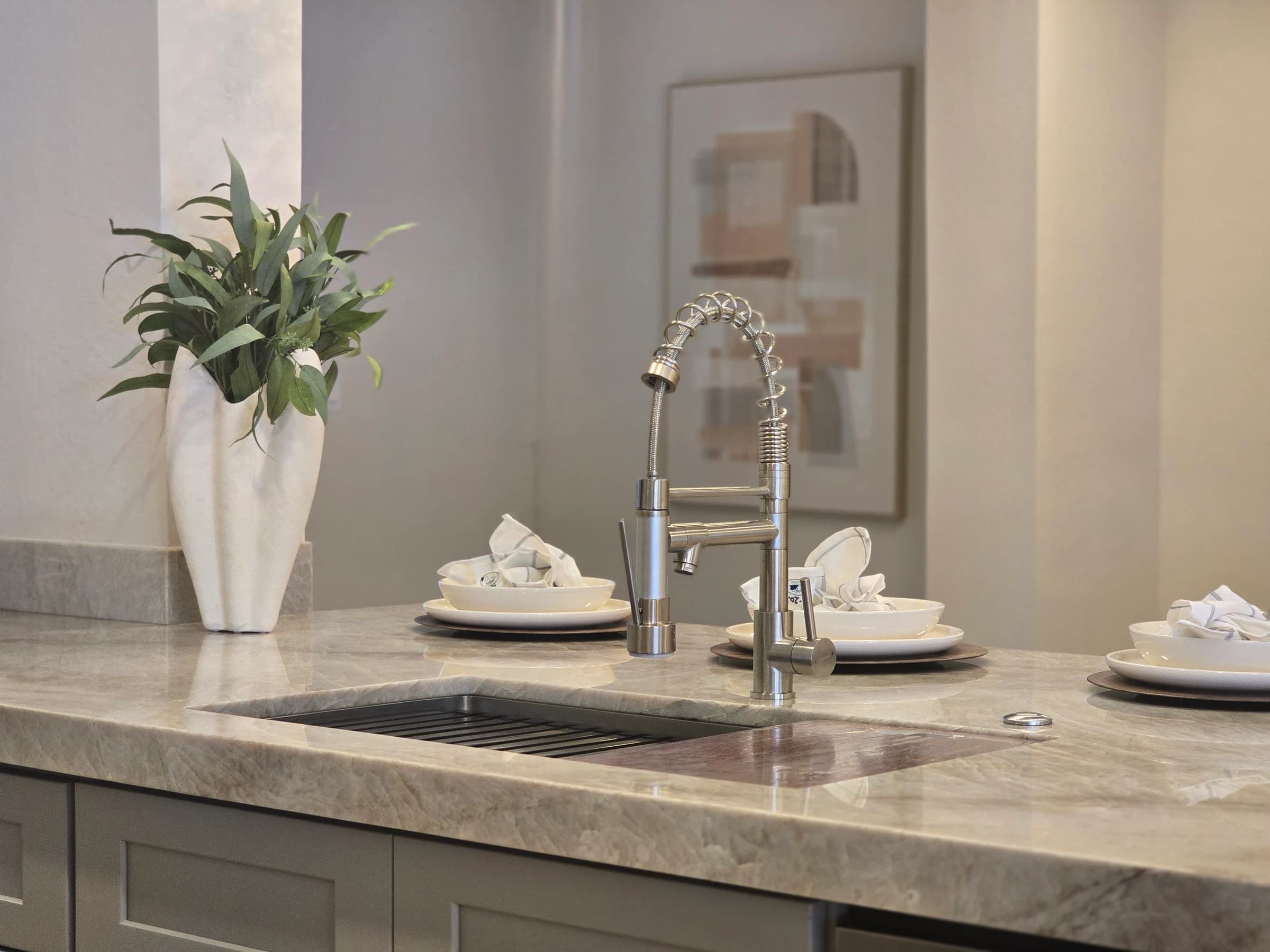 Kitchen faucet on quartzite.