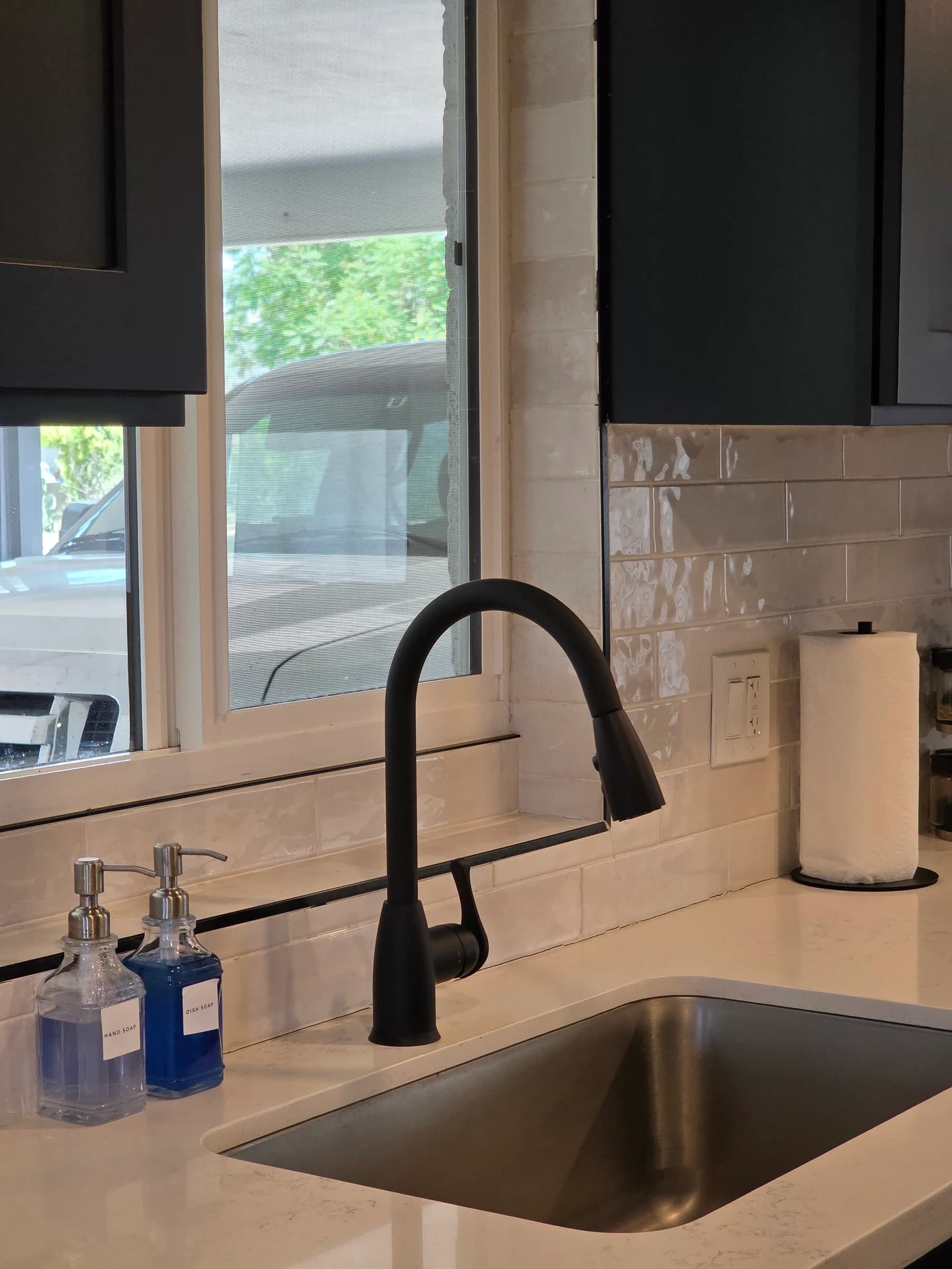 Matte black kitchen faucet, supplied and installed.