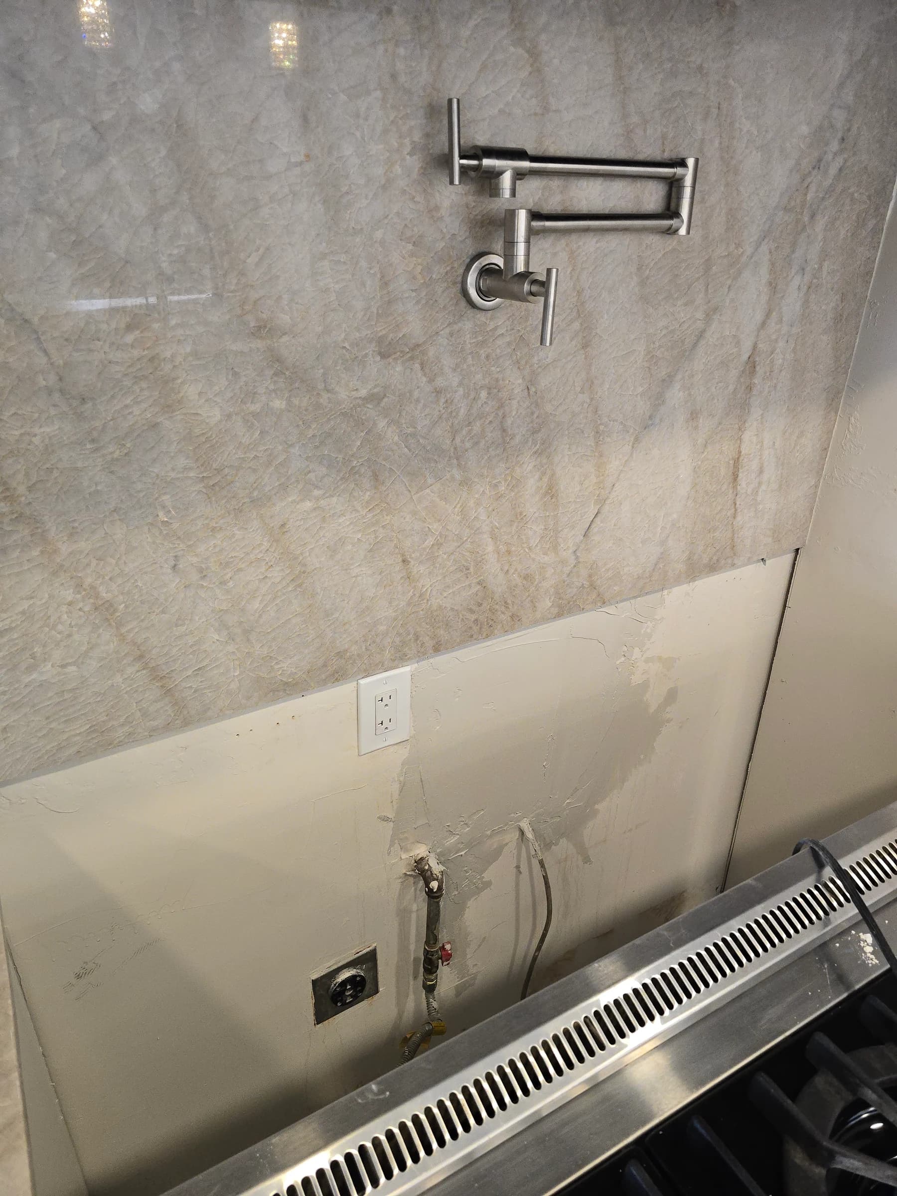 Pot filler run over a range — new supply line and valve.