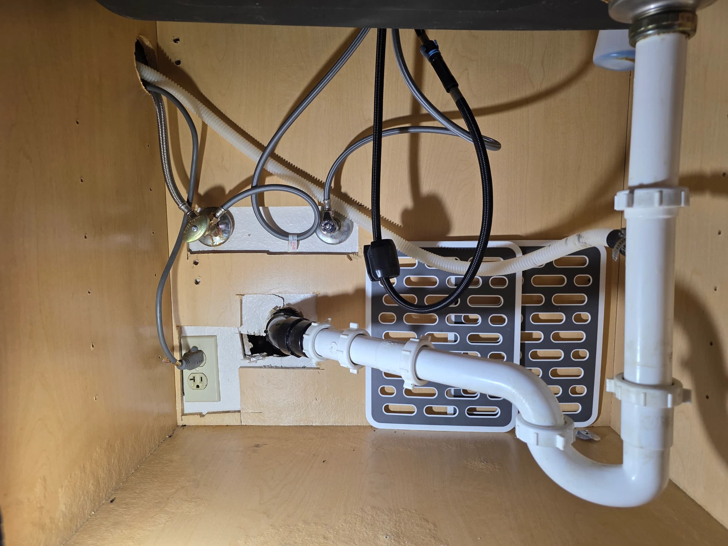 Undermount sink, disposal, and trap connected after a counter install.