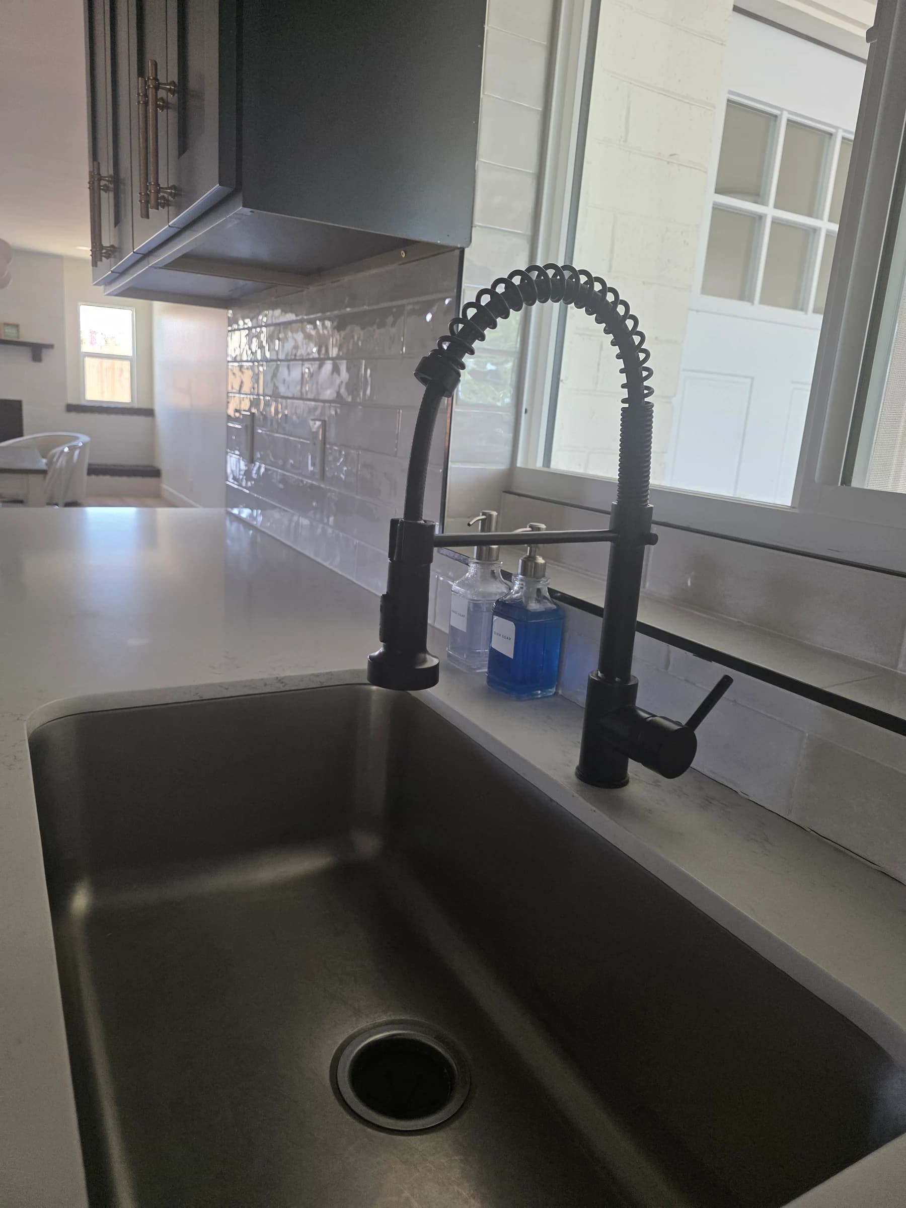 Sink and disposal reconnected after a countertop swap.