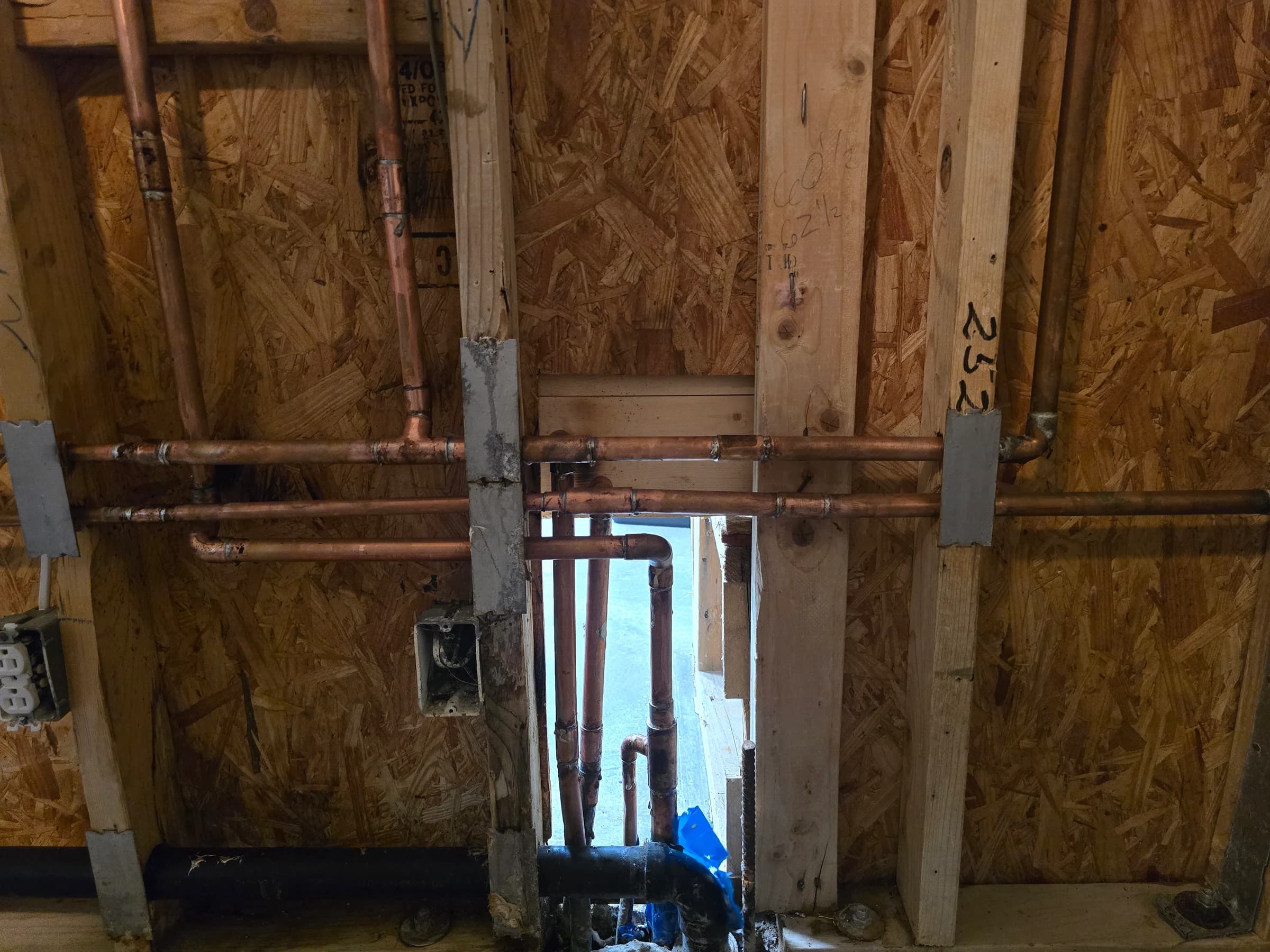 Copper manifold built out and soldered in an open wall.