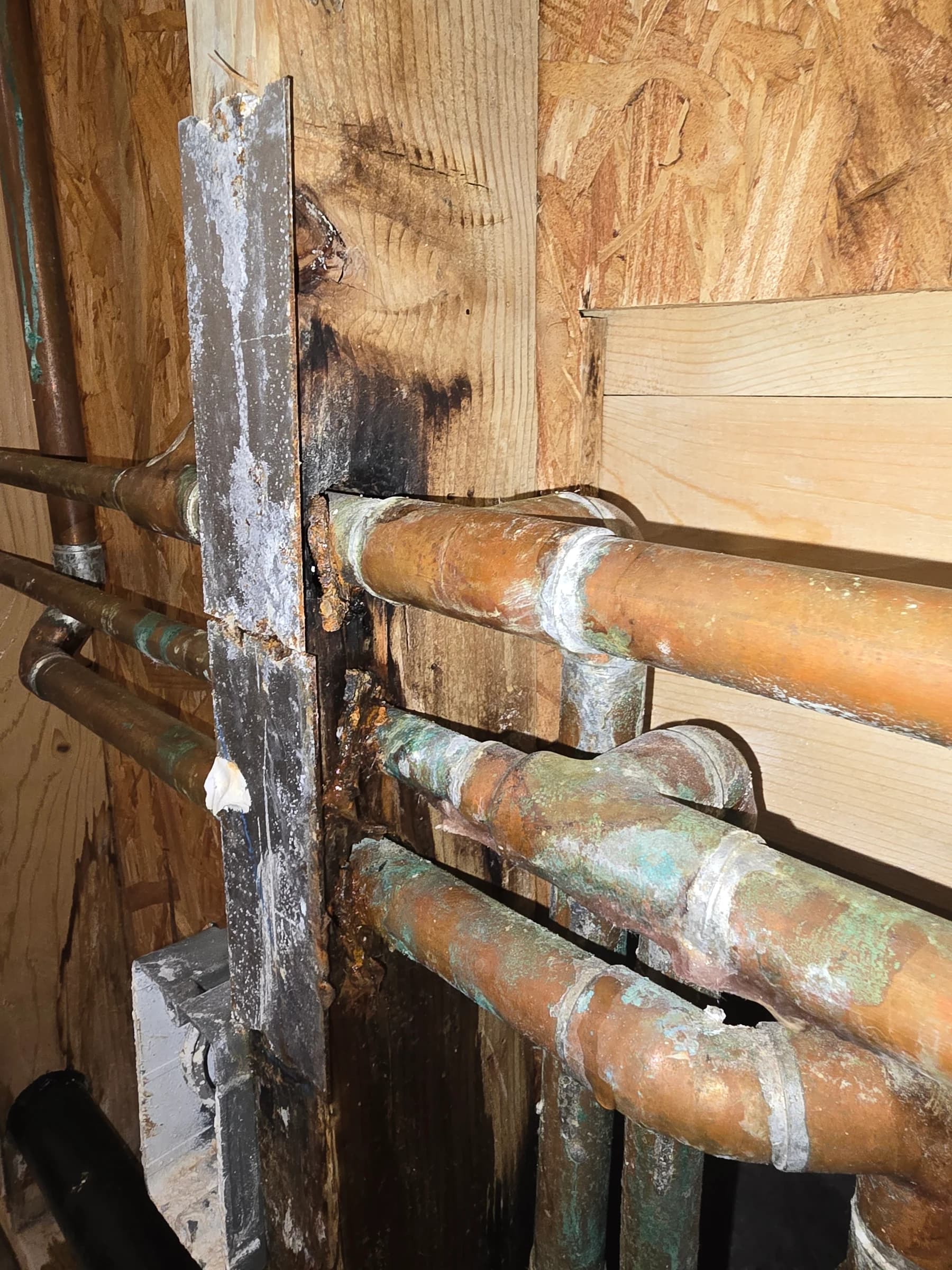 New copper run and soldered joints before the wall closes.