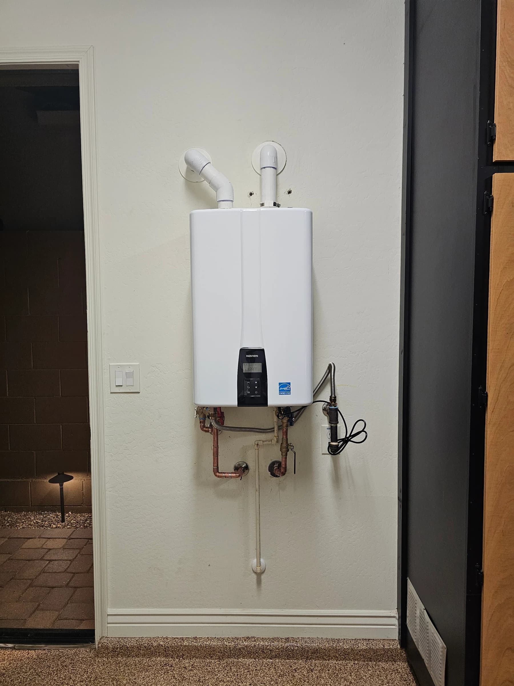 Clean tankless install with service valves fitted for future flushing.